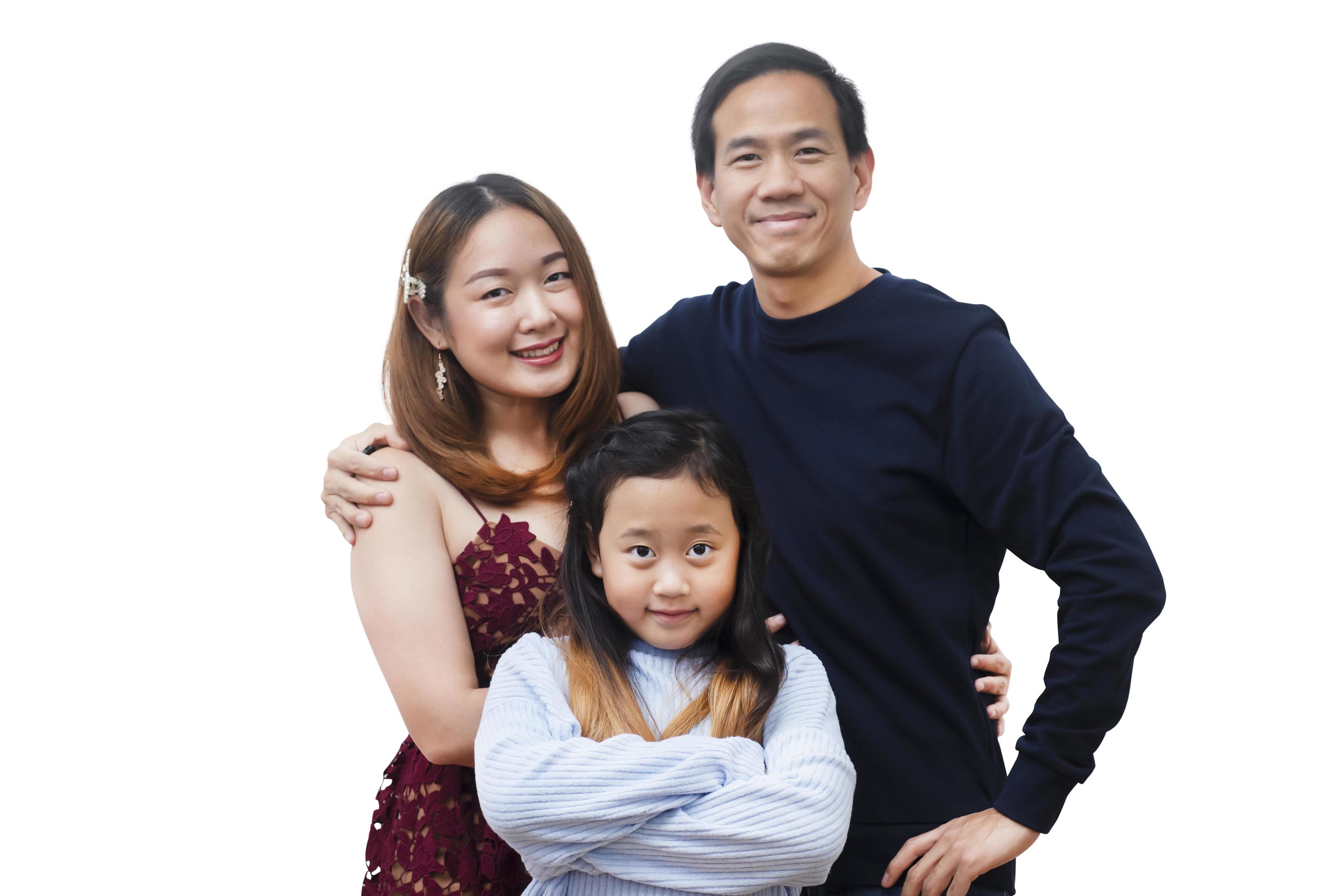 Asian family woman and a man with little junior woman smiling and fun isolated over white background Stock Free