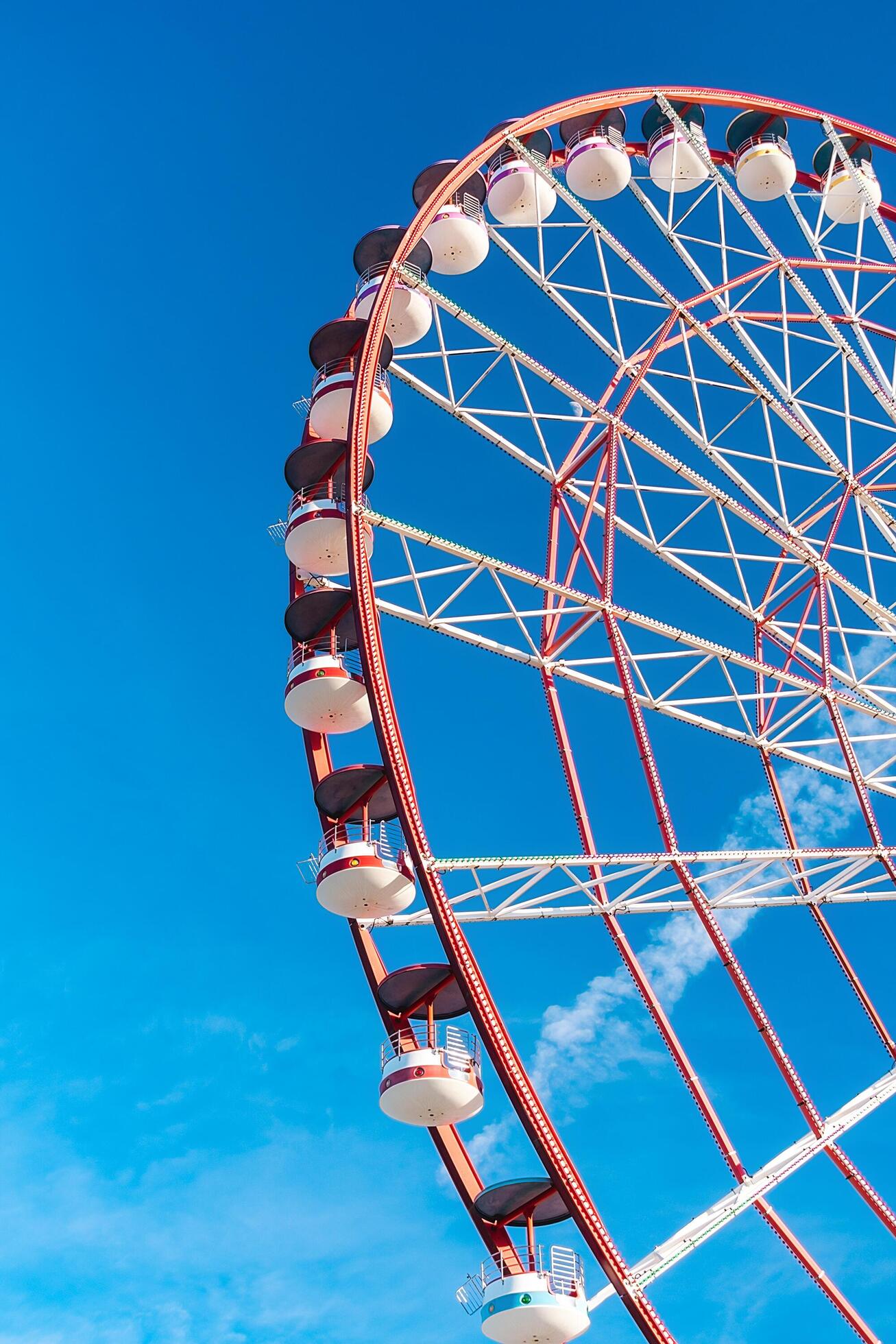 View of the Ferris wheel attraction against a background of blue sky. Ferris wheel in the Georgian city of Batumi. Stock Free