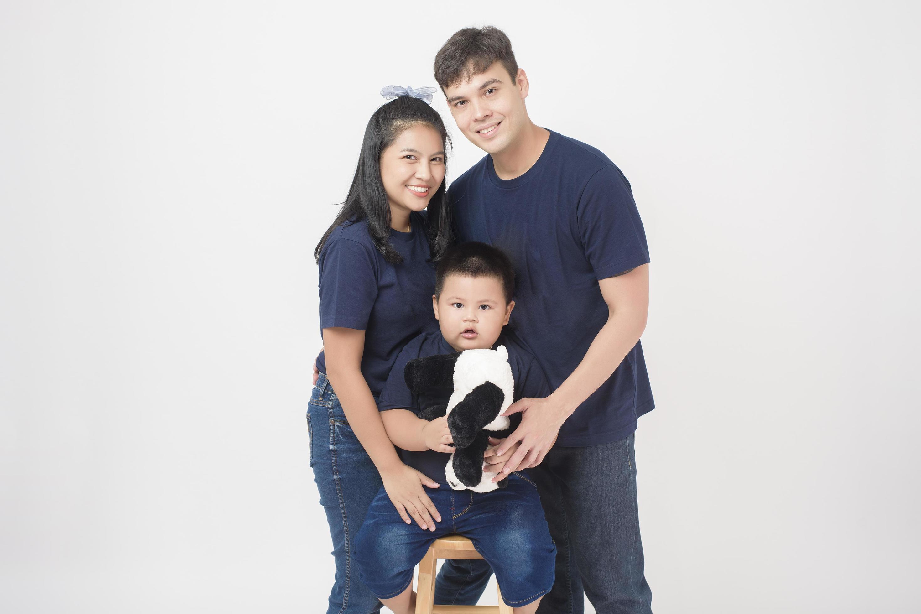 Happy Asian family are enjoy with son in studio Stock Free