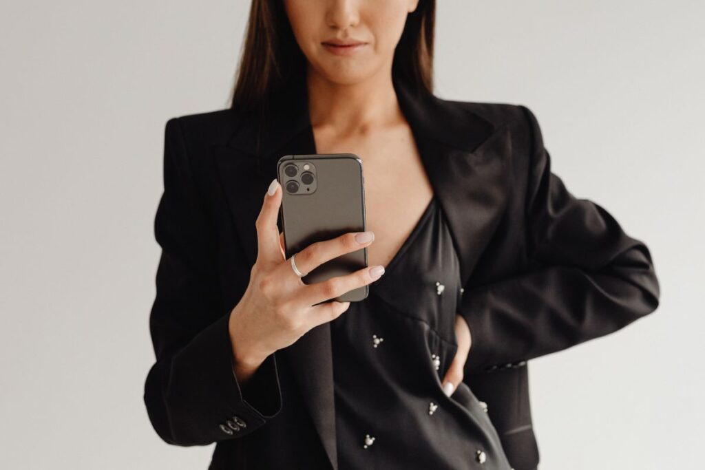 Dark Classy Aesthetic Fashion – Beautiful Asian Female Entrepreneur in Black Suit – Technology and Devices – iPhone – Laptop – AirPods Stock Free