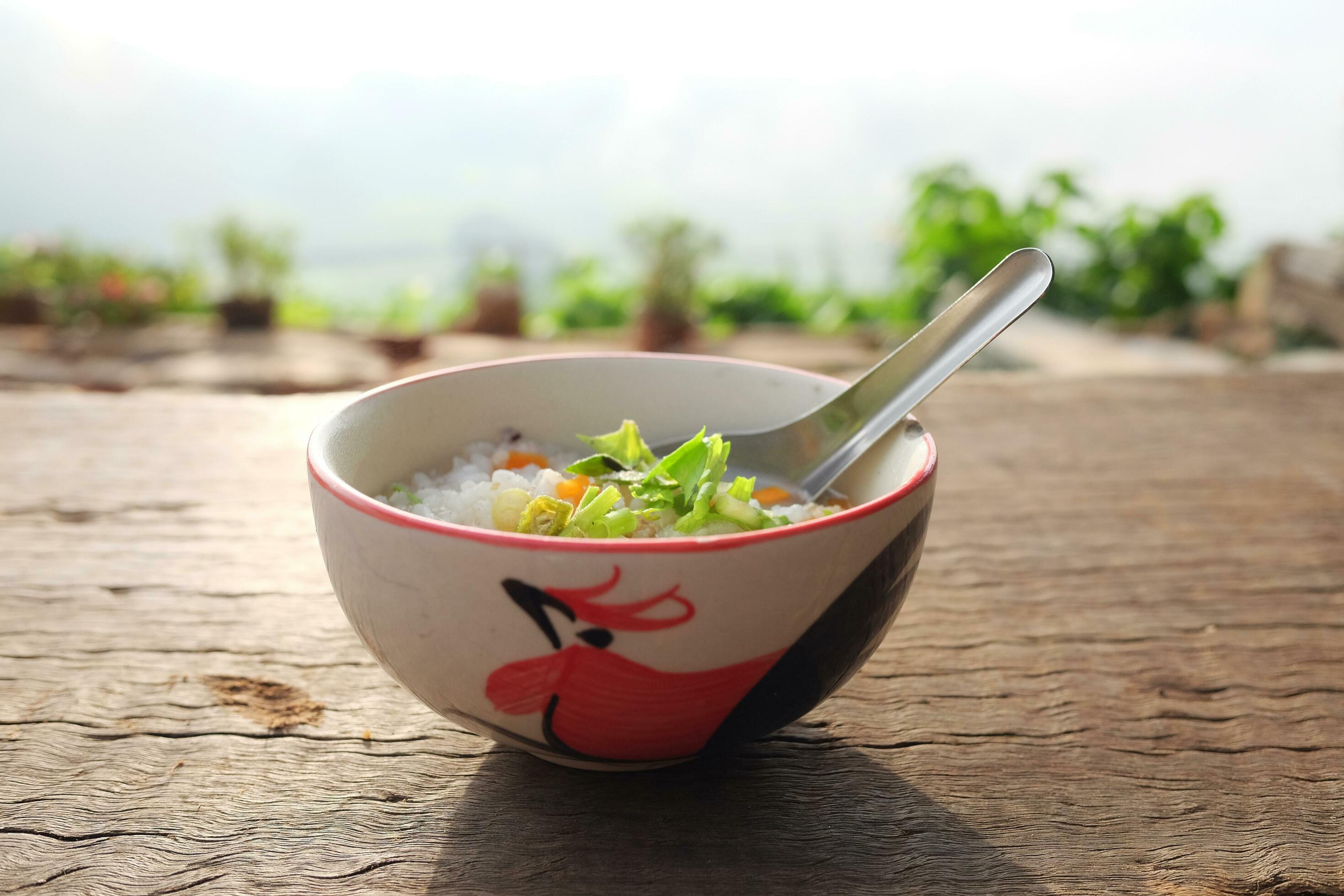 Rice withonions and carrots topping in bowl is tradition food breakfast in Thailand Stock Free