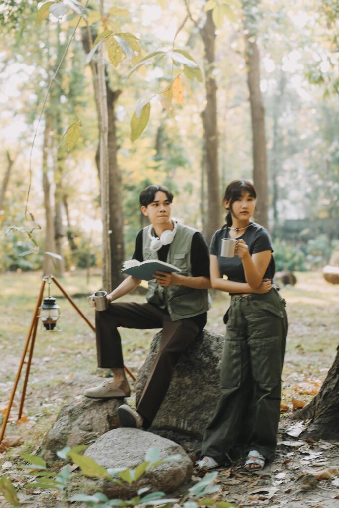 Asian couple sweet in tent inside on they camping trip, traveller relax and sleep togather in out door and camping trip Stock Free