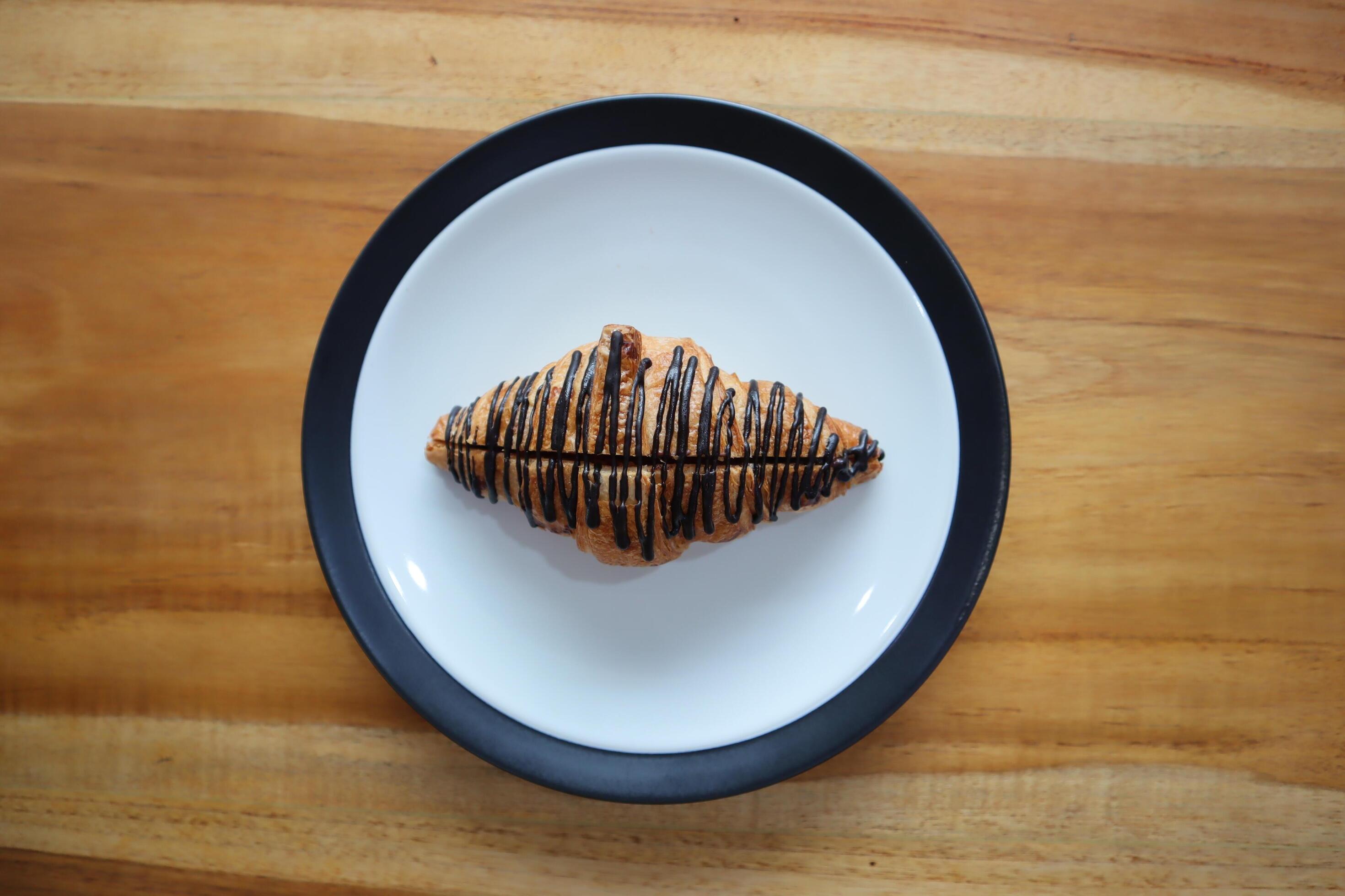 A plate of Chocomalt Croissants on a table background Stock Free