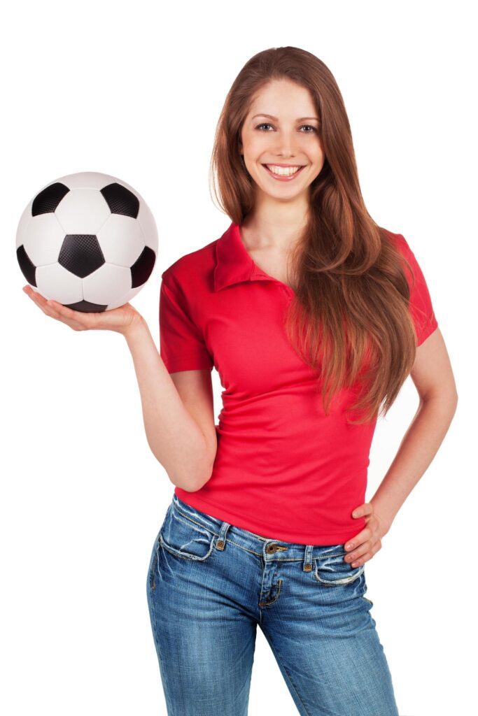 Girl in jeans with soccer Ball Stock Free