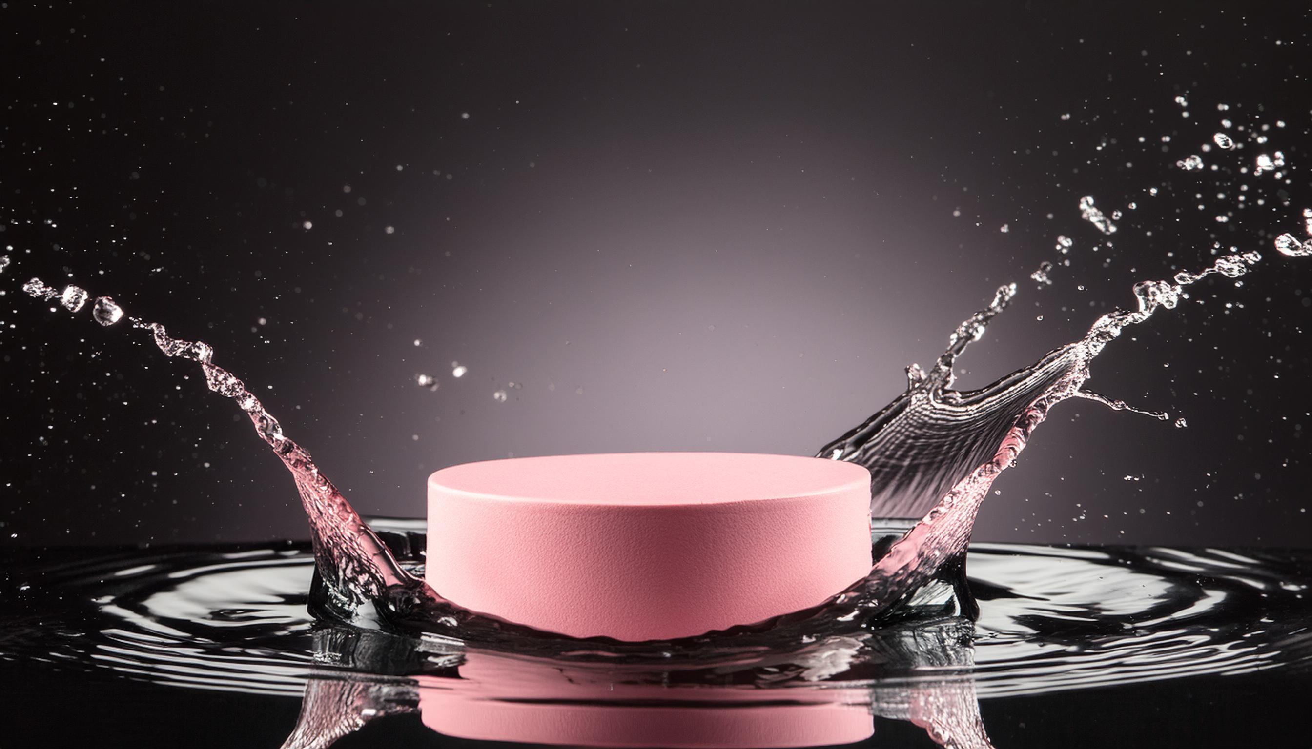 empty pink podium mockup with water splash on a black gradient background for product display Stock Free