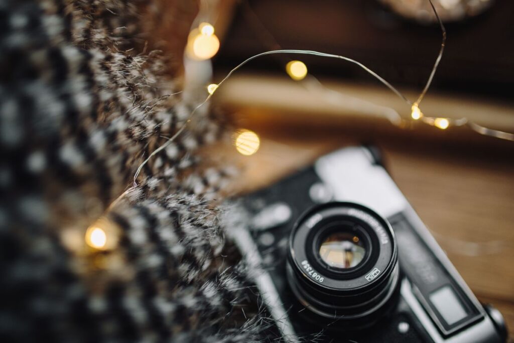 Old camera, mug with tea and books Stock Free