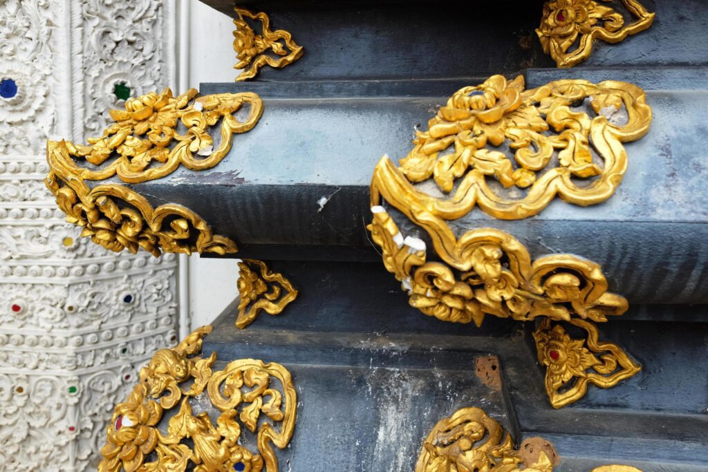 Thai -Lanna golden stucco and sculpture arts detail decorateion on heritage black pagoda in the temple of Thailand Stock Free