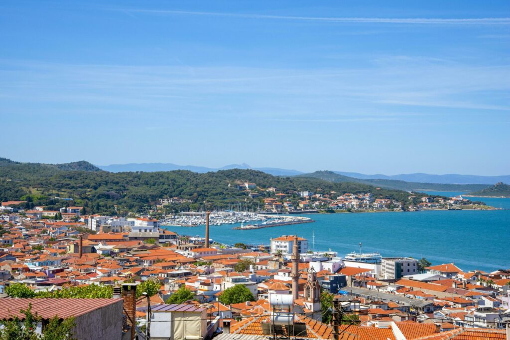 Turkish city with the sea, hills, and red roofs on a summer and sunny day. Stock Free