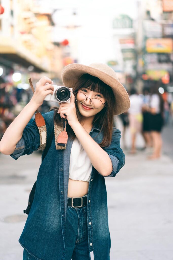 Portrait of happy traveller adut asian cute girl with glasses. Stock Free