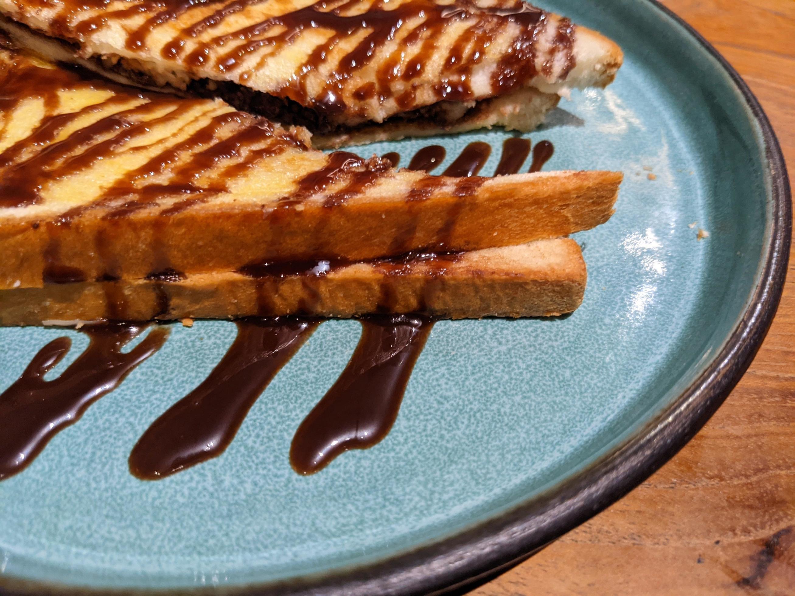 Close up photo of roasted bread with brown sugar and chocolate jam. The photo is suitable to use for food background, poster and food content media. Stock Free