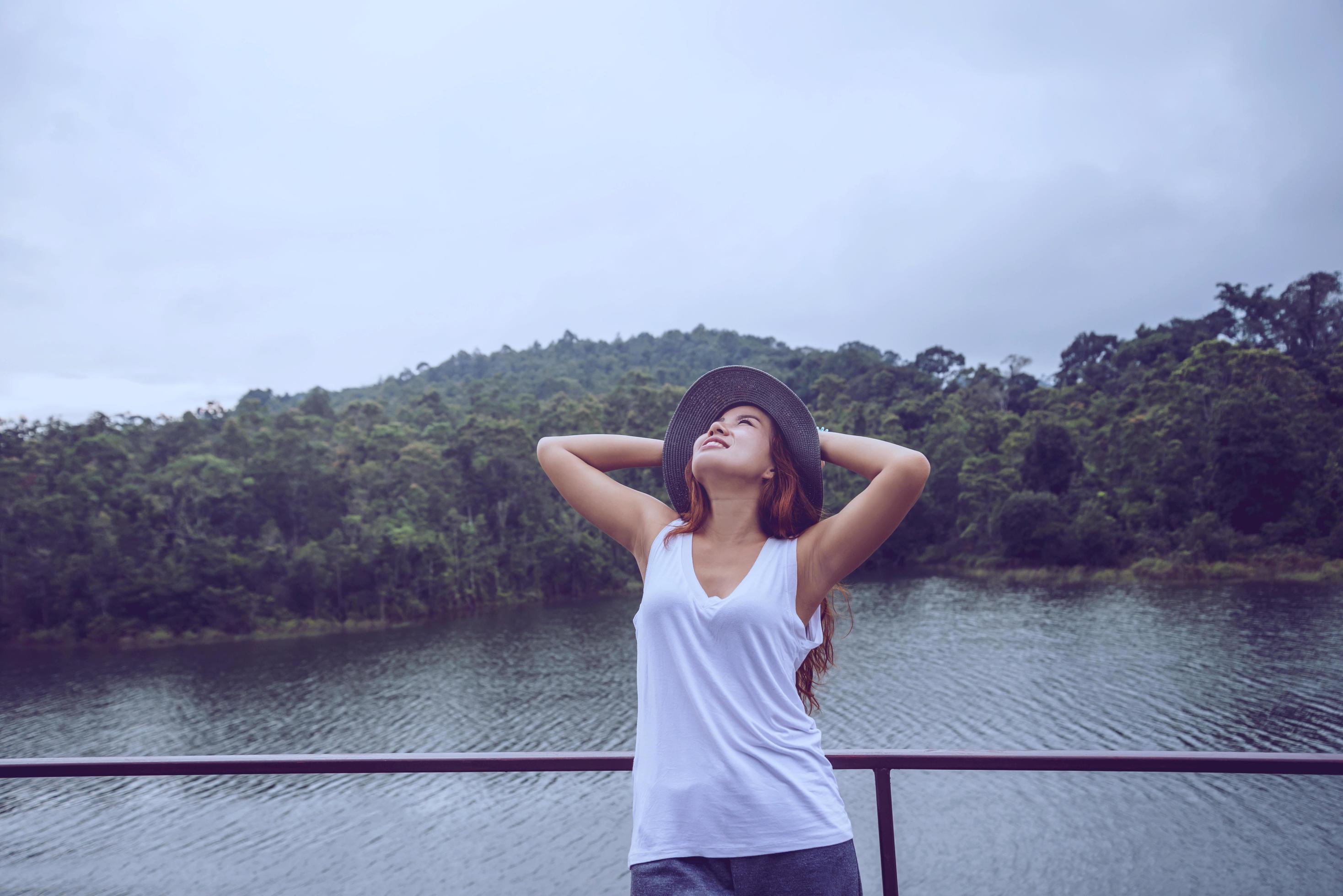 Asian women relax in the holiday. In the natural atmosphere, mountain forest. Stock Free