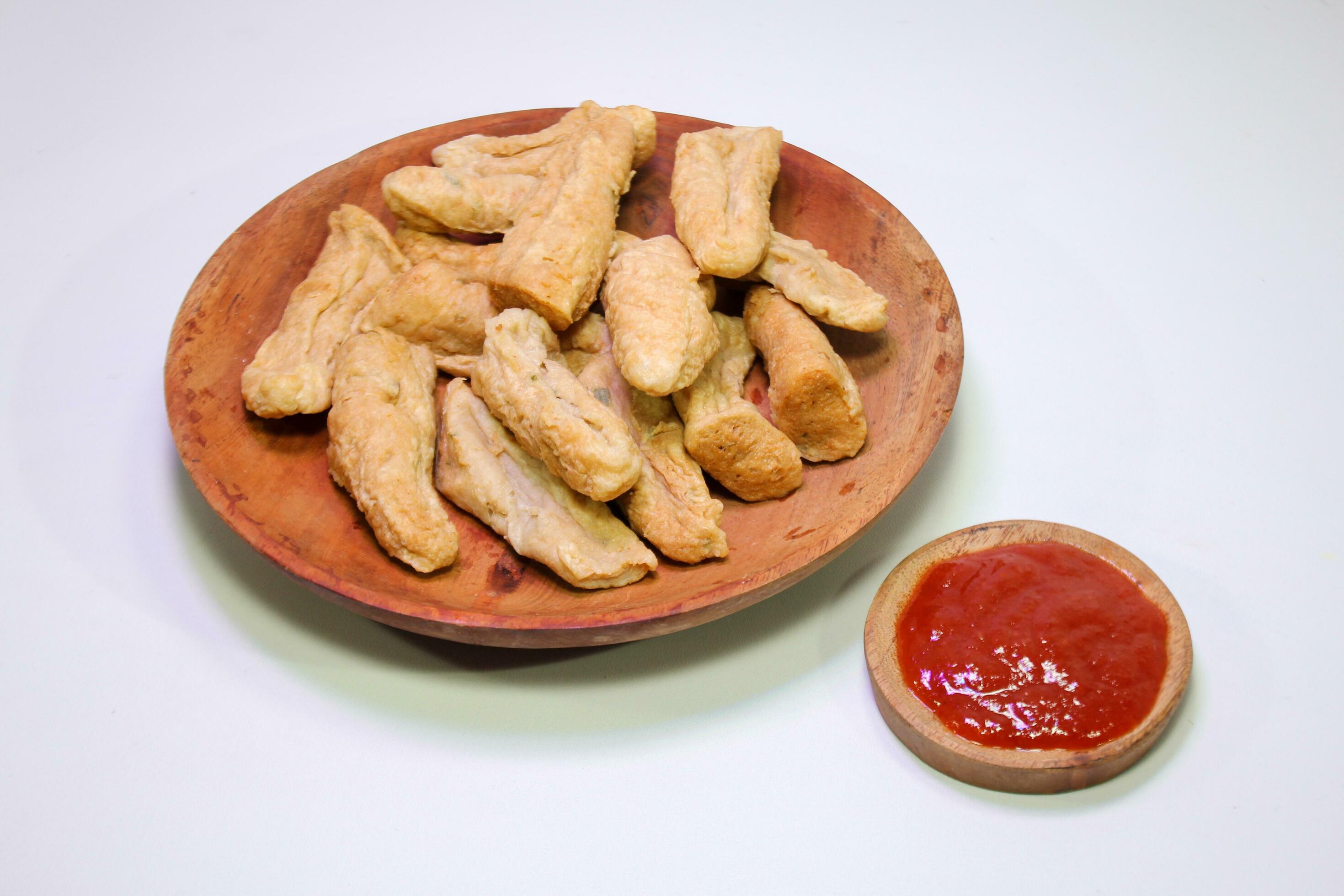 Otak otak a traditional food made from fish and served with served with chili sauce Stock Free