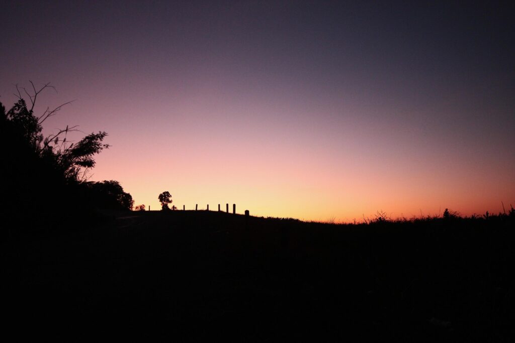 Beautiful silhouette of moments in natural sunrise and sunset on the mountain. Peace, loneliness and Haloween Concept. Stock Free