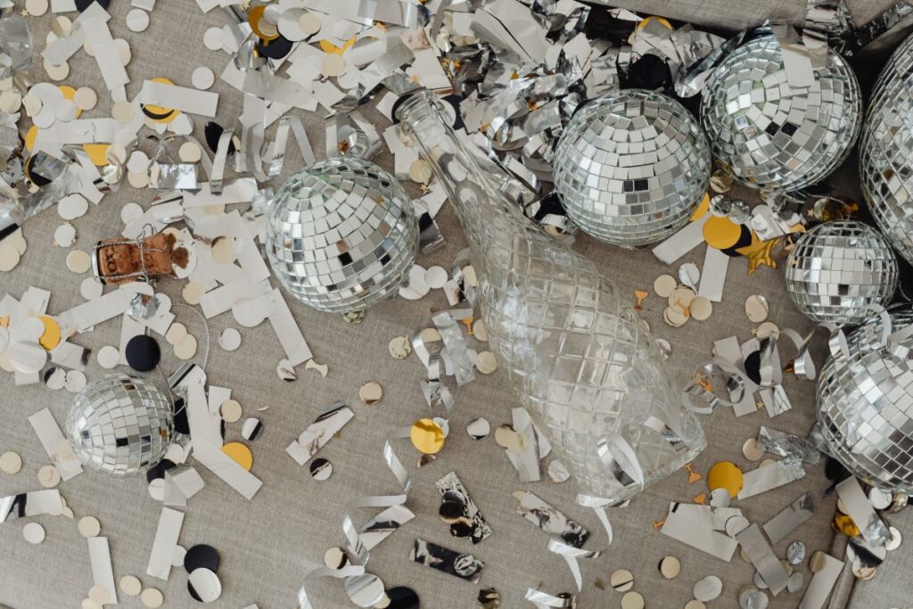 New Year’s Eve party mess – confetti – disco balls Stock Free