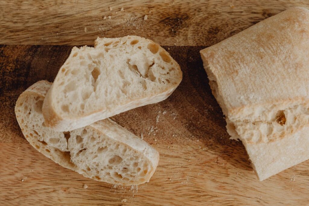 Woman making bruschetta with healthy ingredients Stock Free