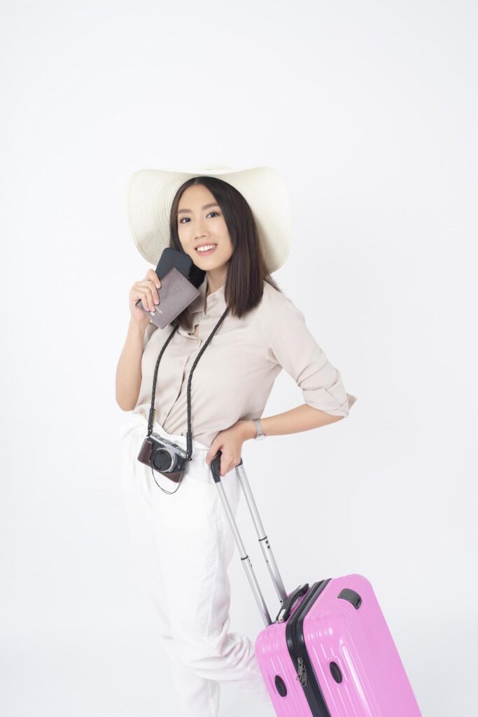 Beautiful Asian woman tourist on white background Stock Free