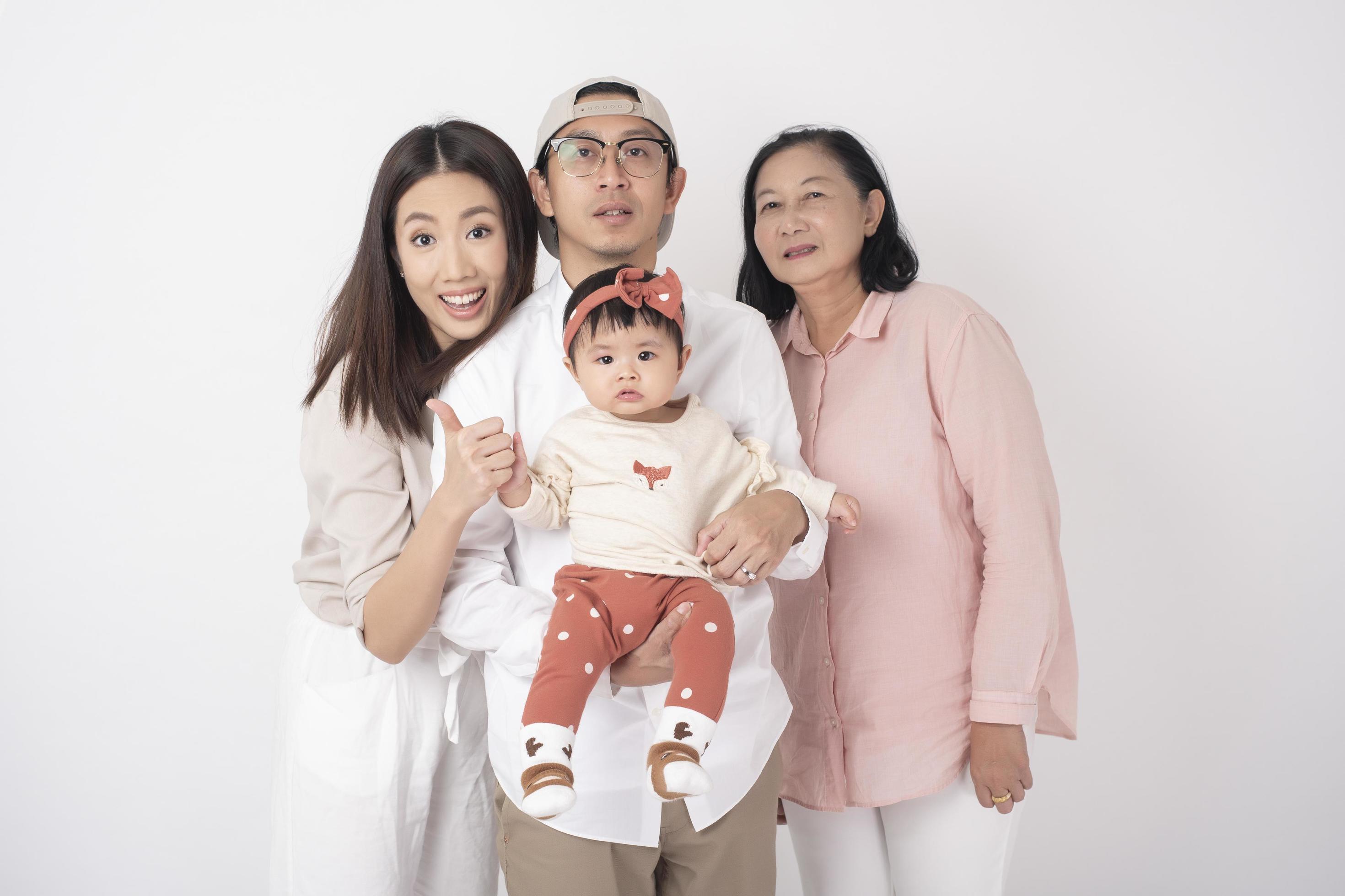 Happy Asian family on white background Stock Free