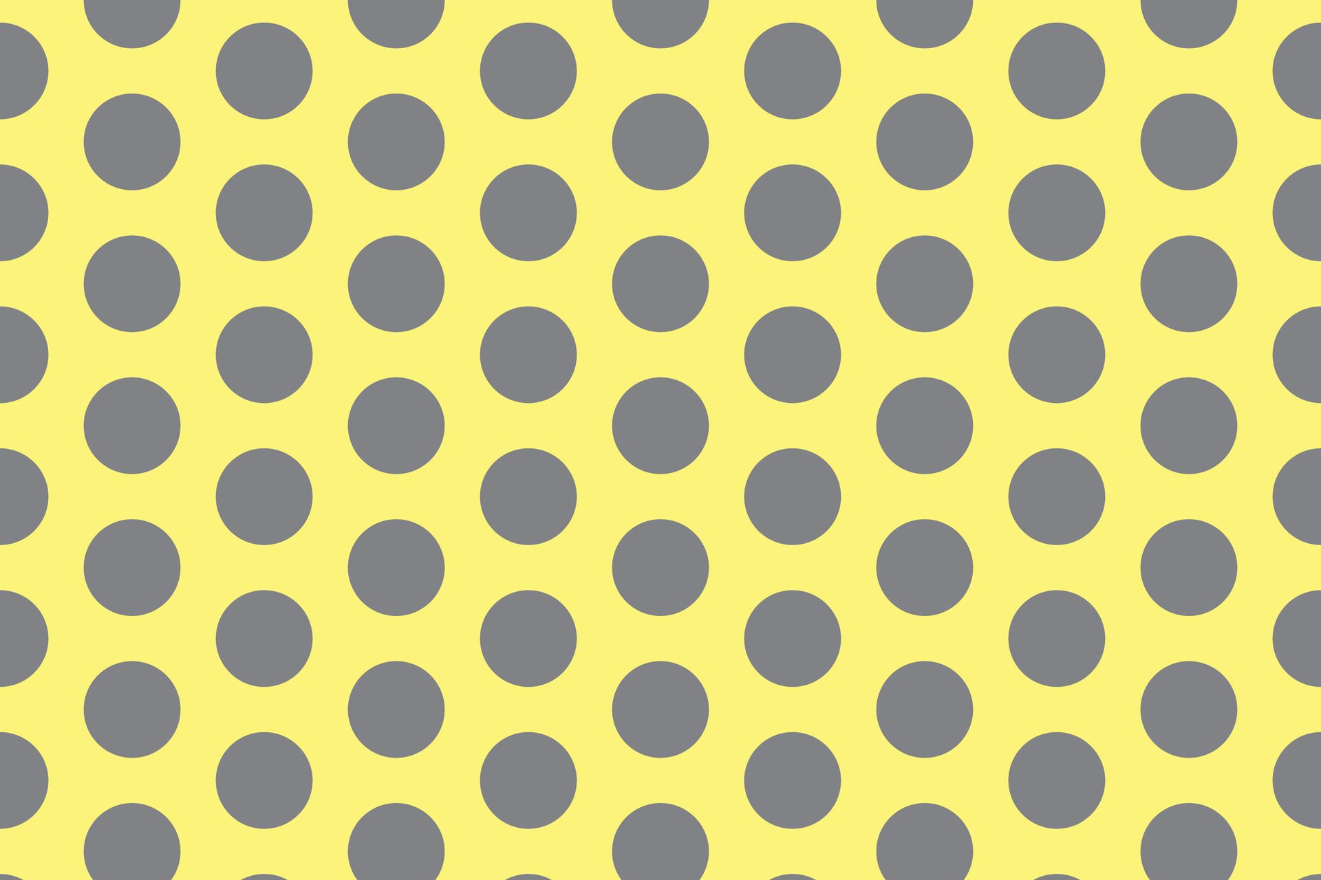 simple abstract grey ash color big polka dot pattern on lite yellow color background a yellow background with a pattern of dots Free Vector