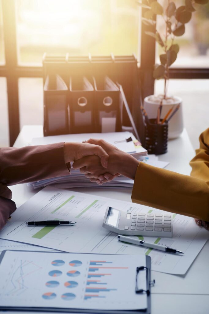 Teamwork executives colleagues business people handshake after meeting Stock Free