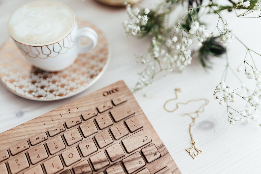 Wooden keyboard and cup of coffee Stock Free