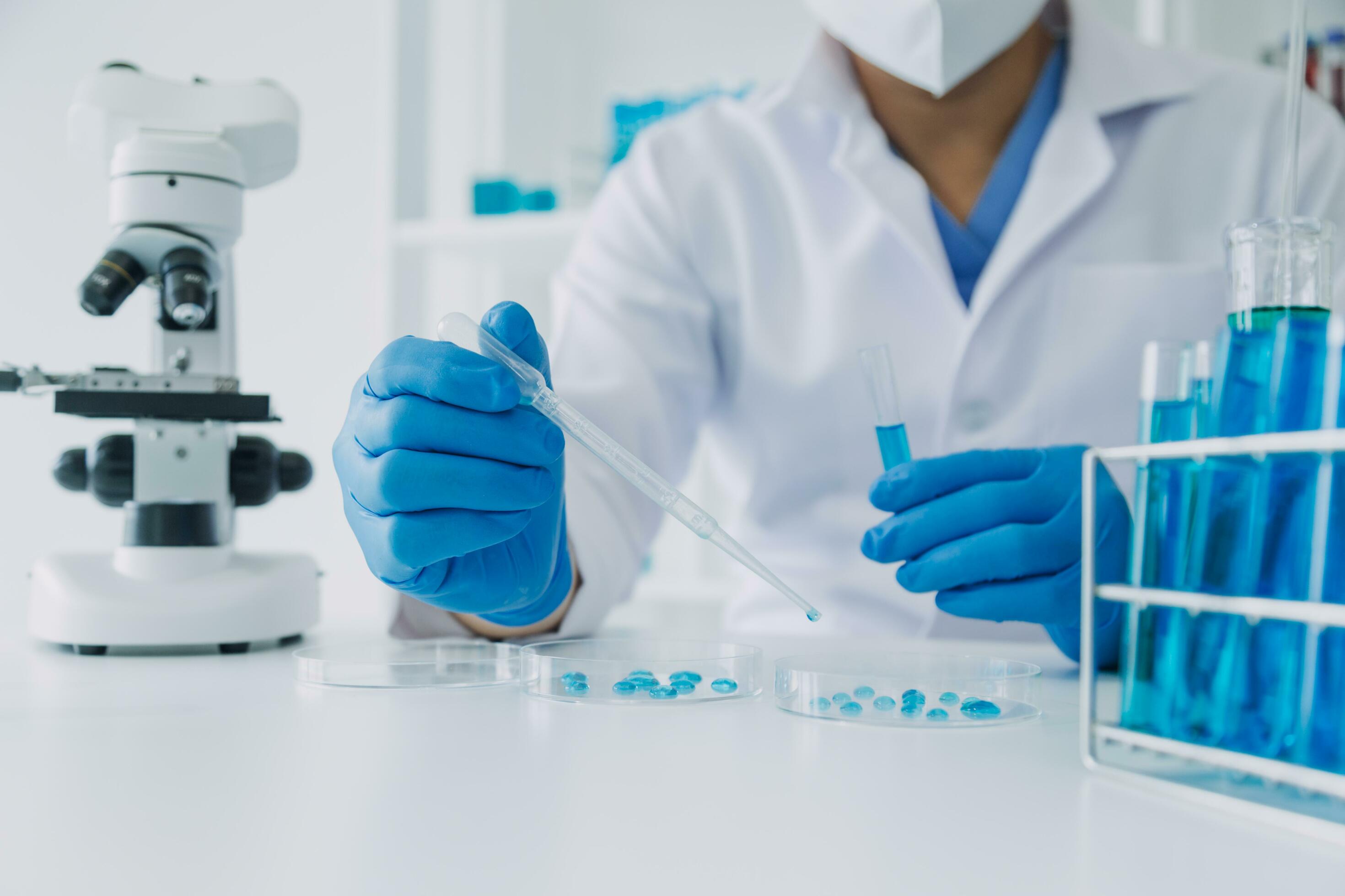 hand of scientist with test tube and flask in medical chemistry lab blue banner background Stock Free