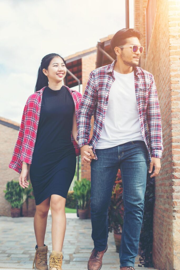 Young hipster love couple enjoying with summer holiday together walking on the street in urban town. Stock Free