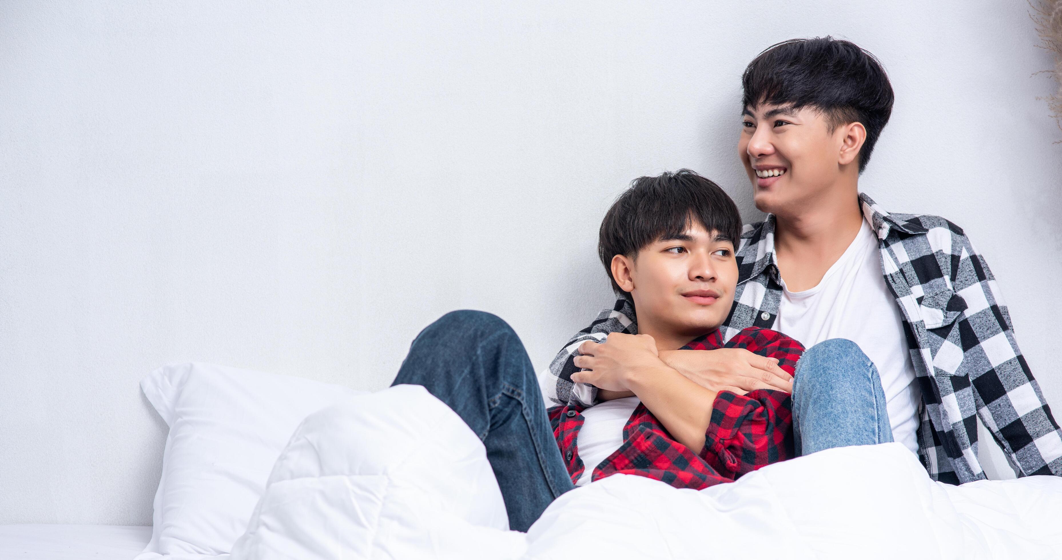 Two beloved young men slept in bed together. Stock Free