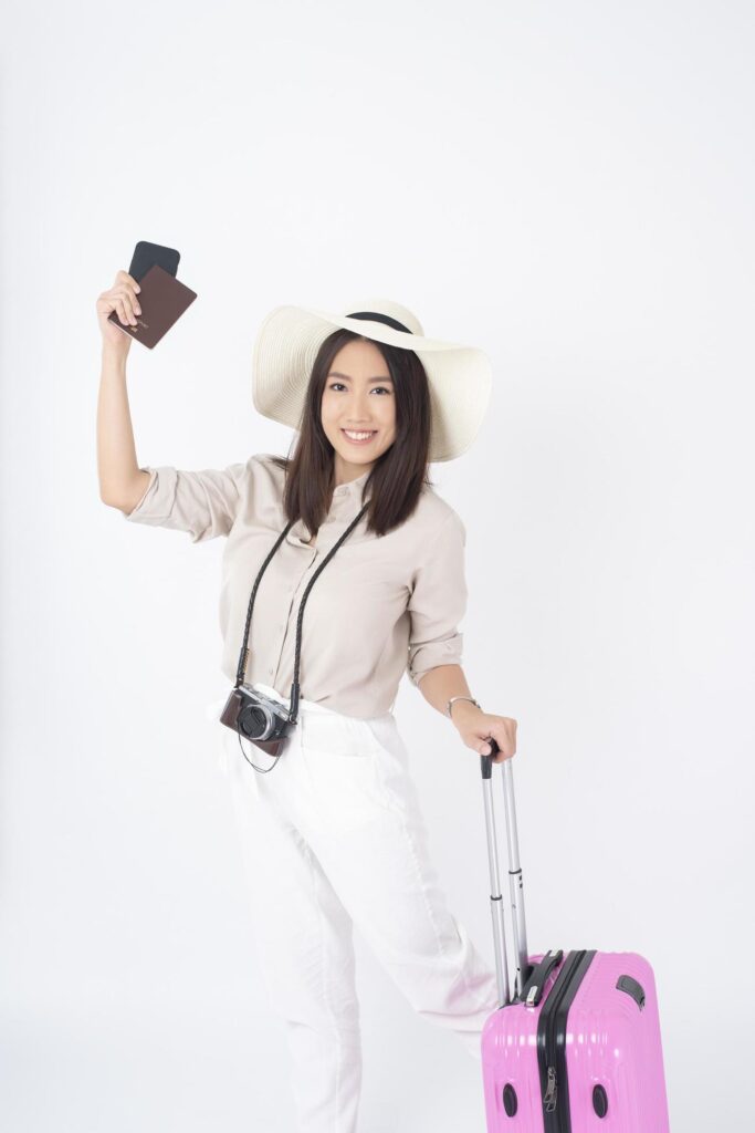 Beautiful Asian woman tourist on white background Stock Free