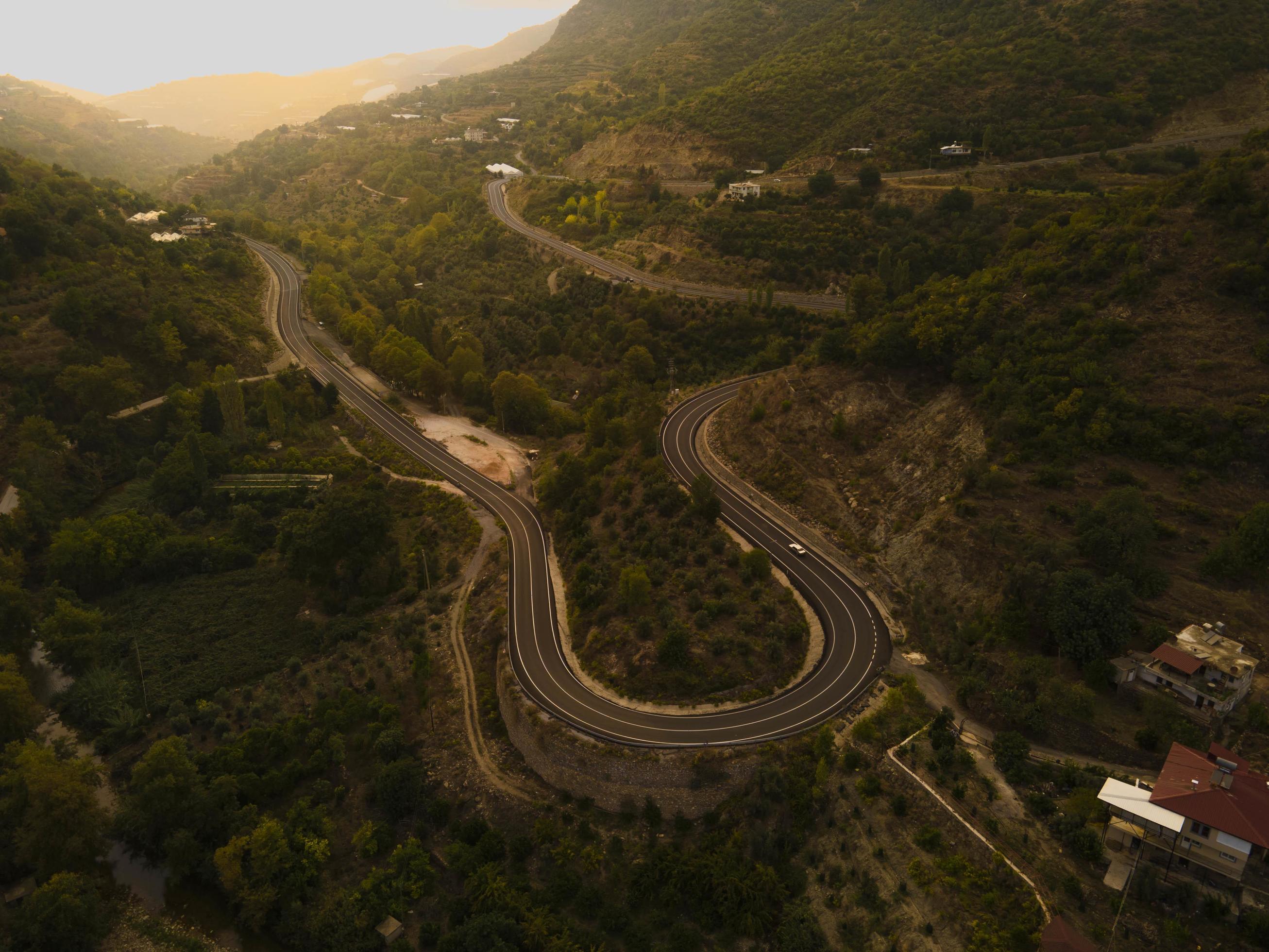 aerial valley and road, Top view, amazing nature background. sunset Flying drone, seascape Stock Free