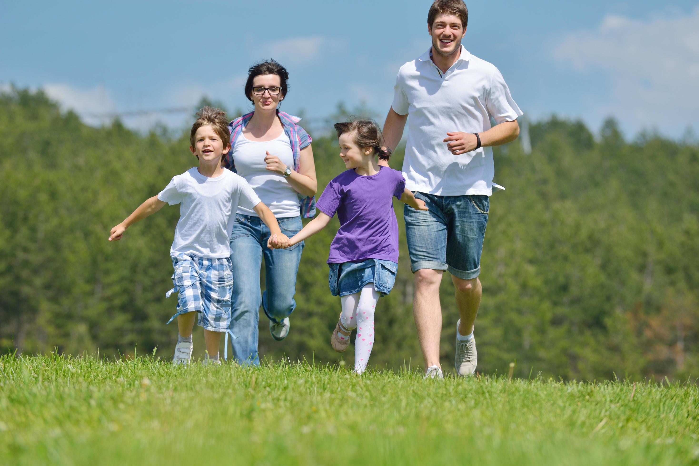 happy young family have fun outdoors Stock Free