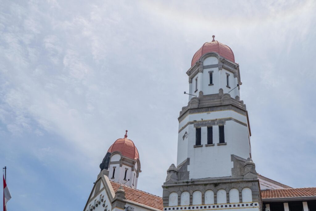 Tower on old mansion of Semarang Central Java with blue sky. The photo is suitable to use for travel destination, holiday poster and travel content media. Stock Free