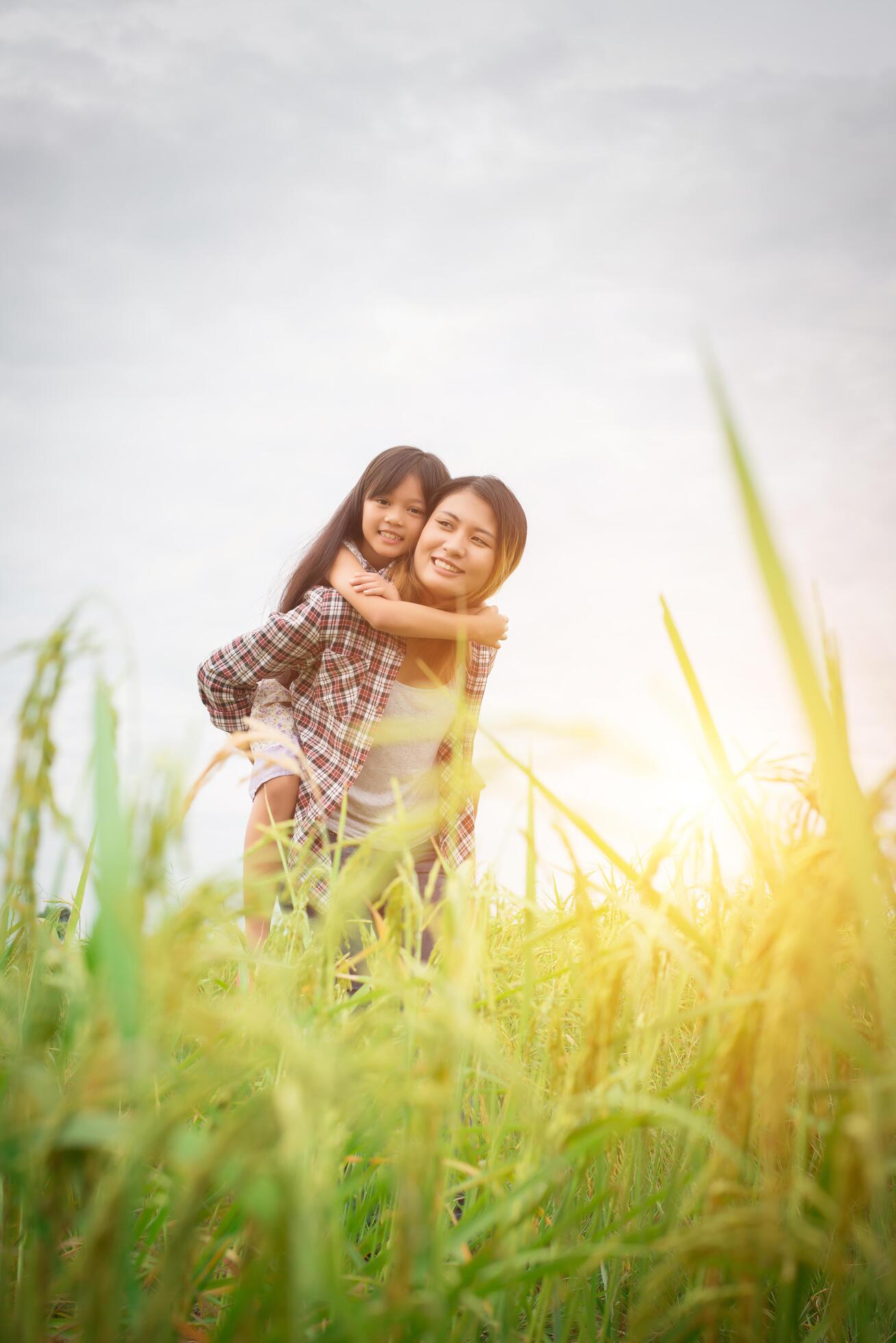 Portrait mom and daughter playing outdoor, enjoying family time. Stock Free