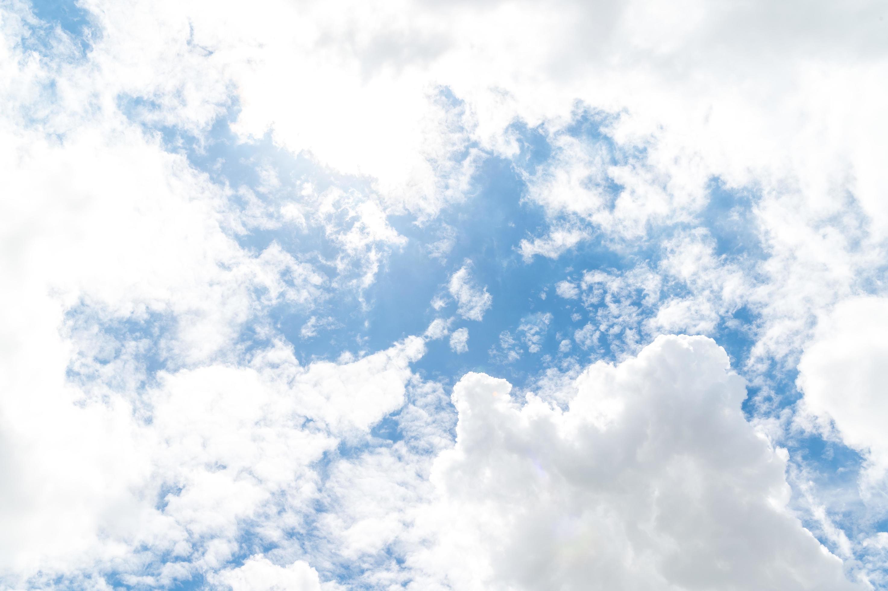 Beautiful white fluffy clouds in blue sky. Nature background from white clouds in sunny day Stock Free