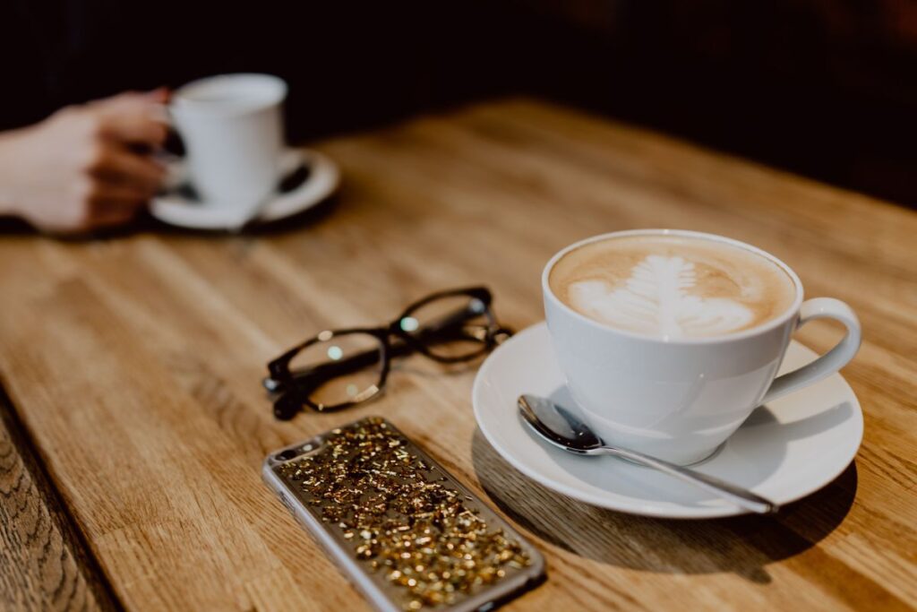 
									Cup of coffee on table in cafe Stock Free