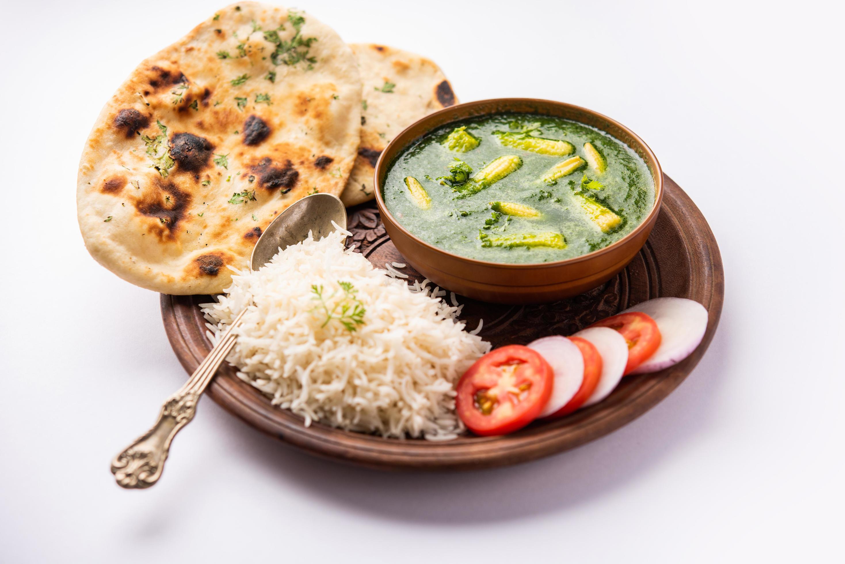 palak baby corn sabzi also known as spinach makai curry served with rice or roti, Indian food Stock Free