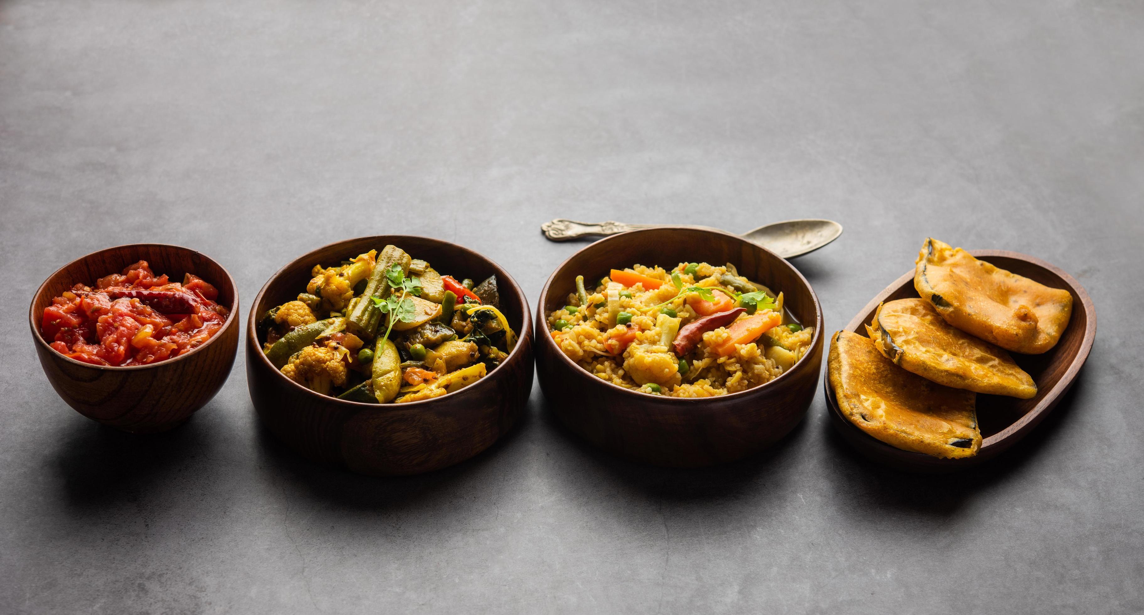 Bengali Bhog food for Indian Hindu Durga Puja or pooja festival. Khichadi, labra, tomato chutney Stock Free