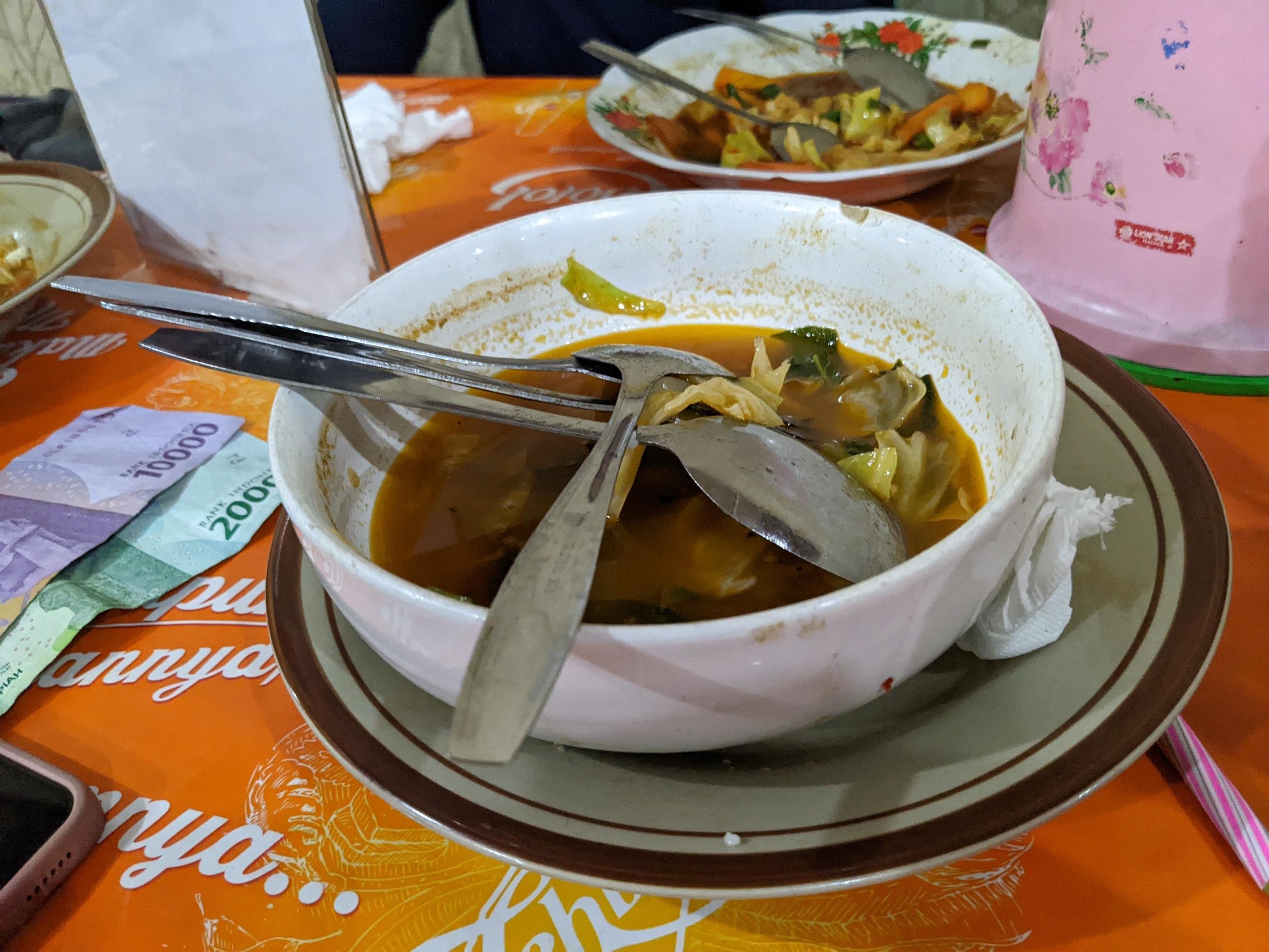 Plate and bowl after finish dinner on the traditional restaurant. The photo is suitable to use for food background, poster and food content media. Stock Free