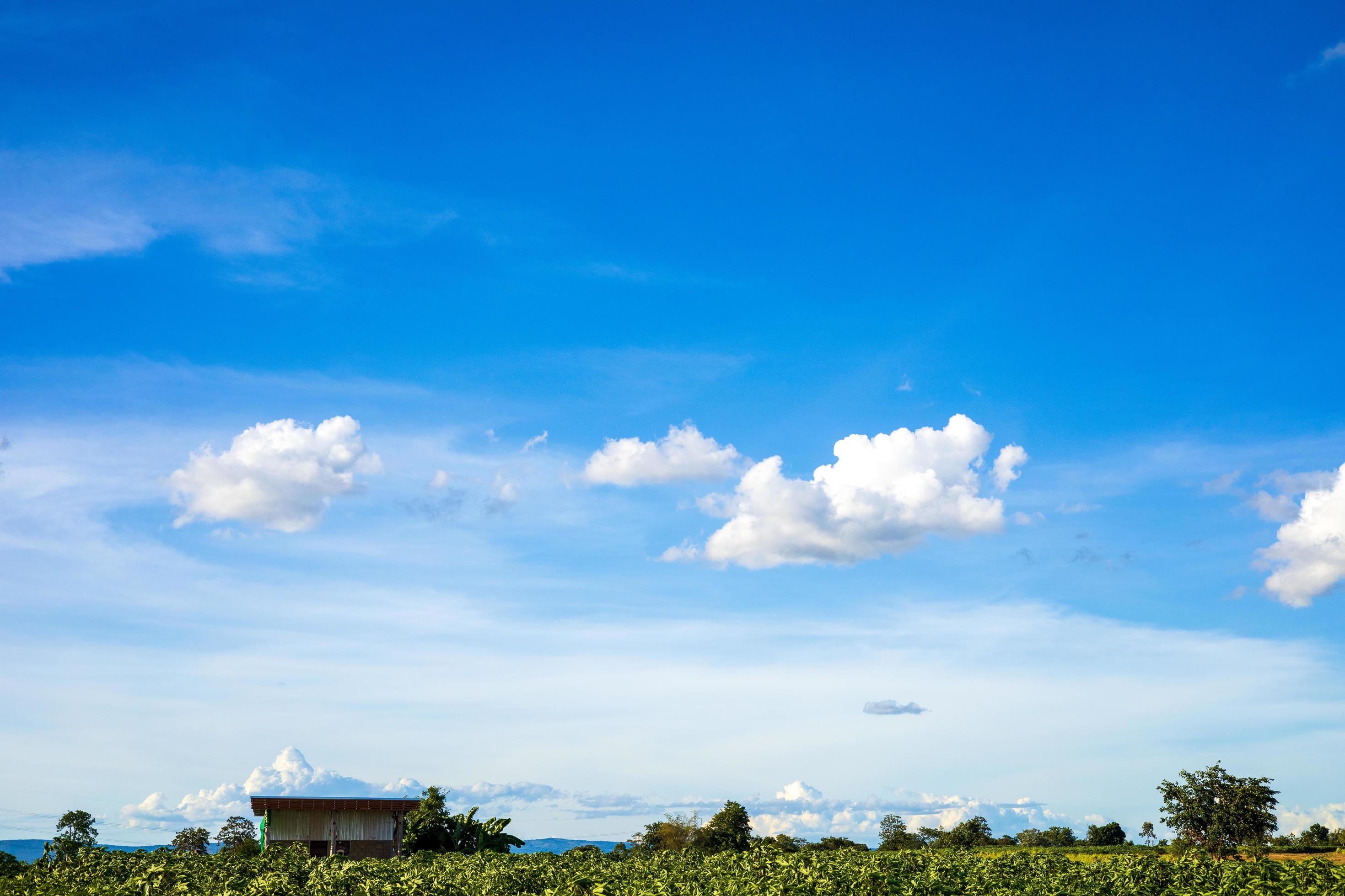 Beautiful bright blue sky with white clouds, nature background concept. Stock Free