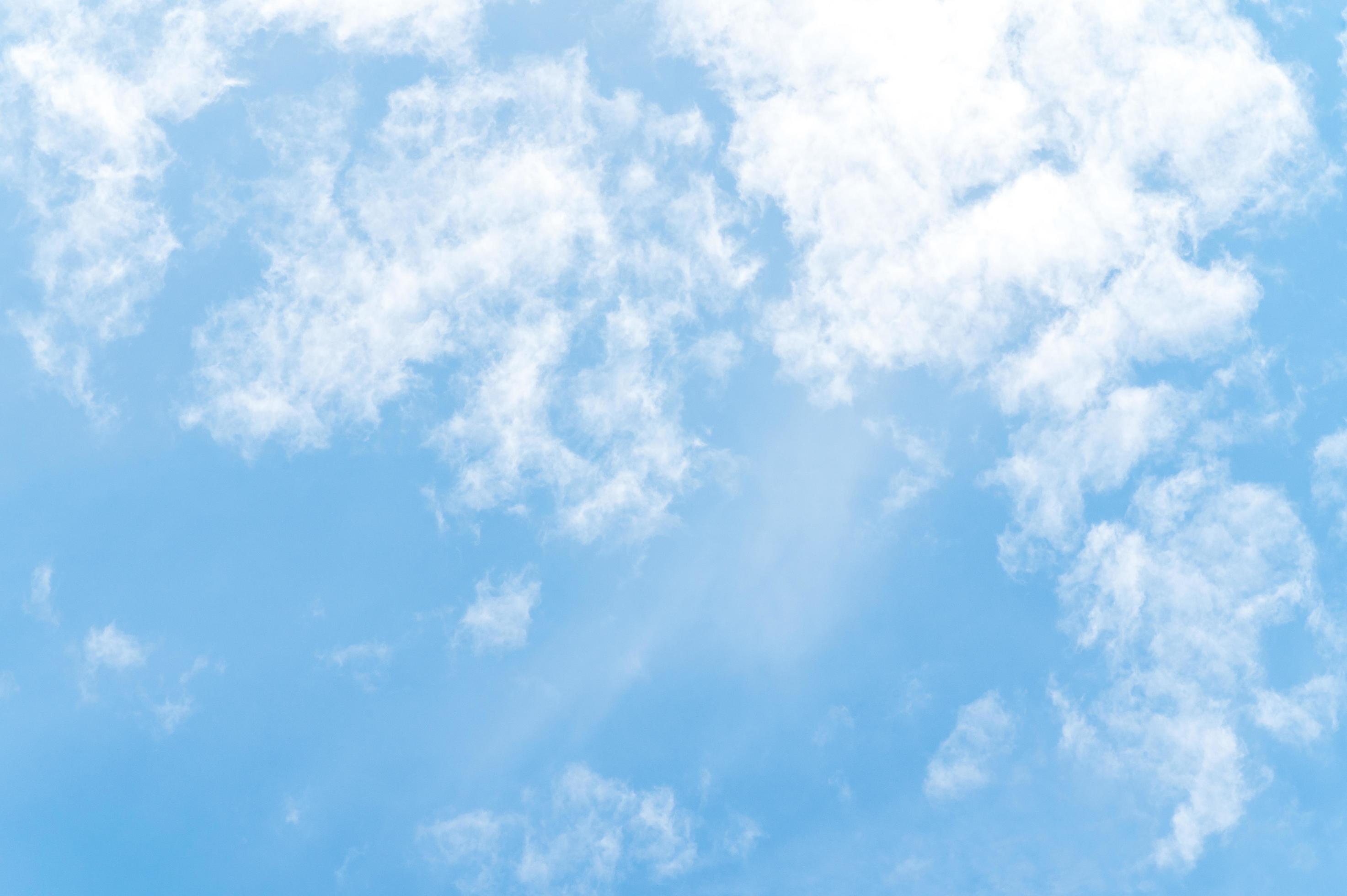 Beautiful white fluffy clouds in blue sky. Nature background from white clouds in sunny day Stock Free