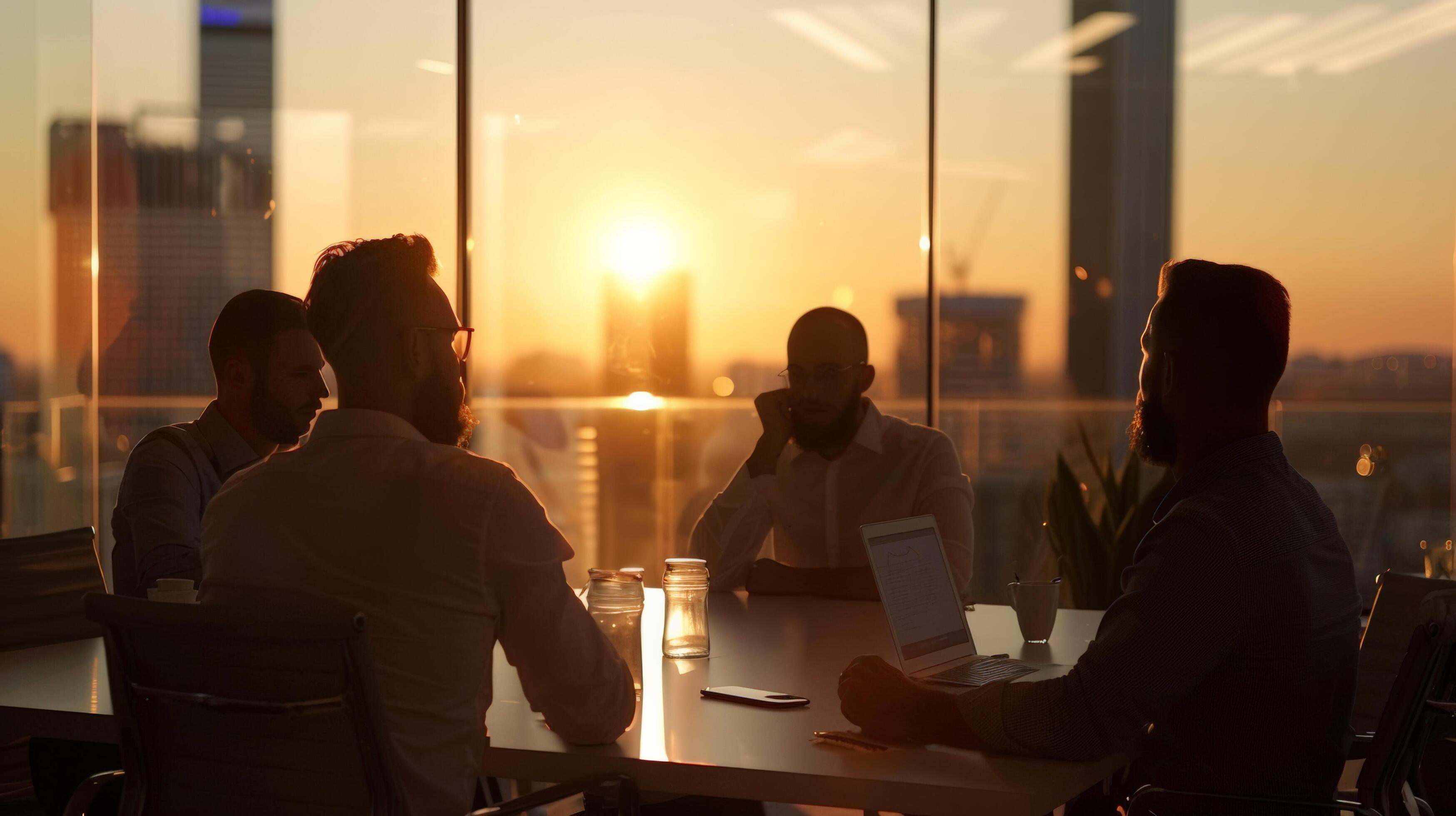 Business meeting in modern office at sunset with cityscape view through windows. Group of professionals discussing project strategy Stock Free