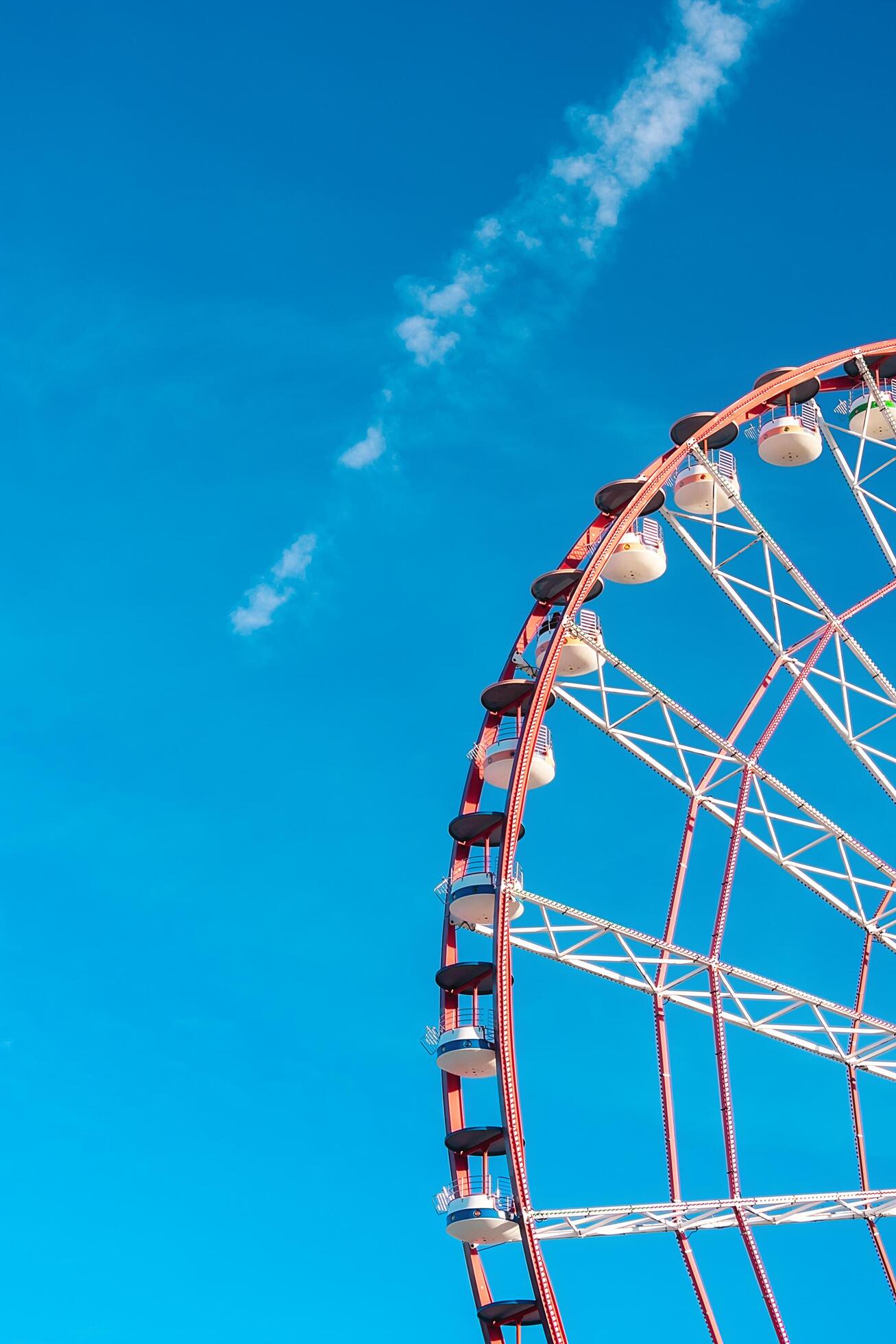 View of the Ferris wheel attraction against a background of blue sky. Ferris wheel in the Georgian city of Batumi. Stock Free