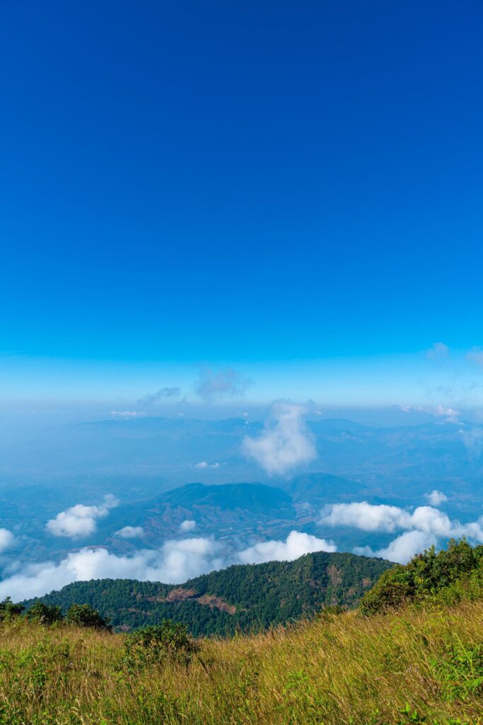 Beautiful mountain layer with clouds and blue sky at Kew Mae Pan Nature Trail in Chiang Mai, Thailand Stock Free