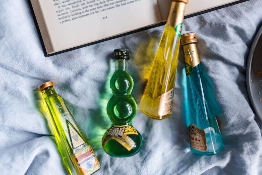 Group of colorful little bottles with liqueurs Stock Free