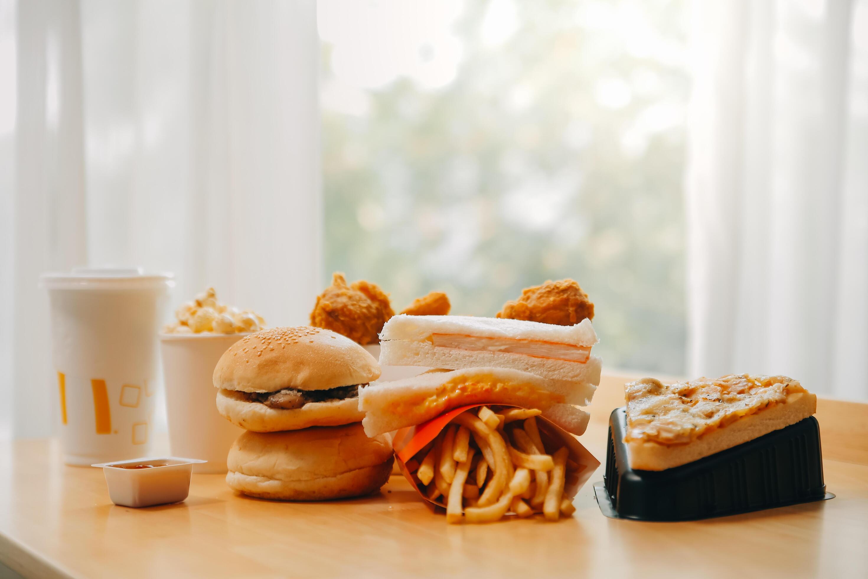 Closeup of home made burgers on wooden background Stock Free