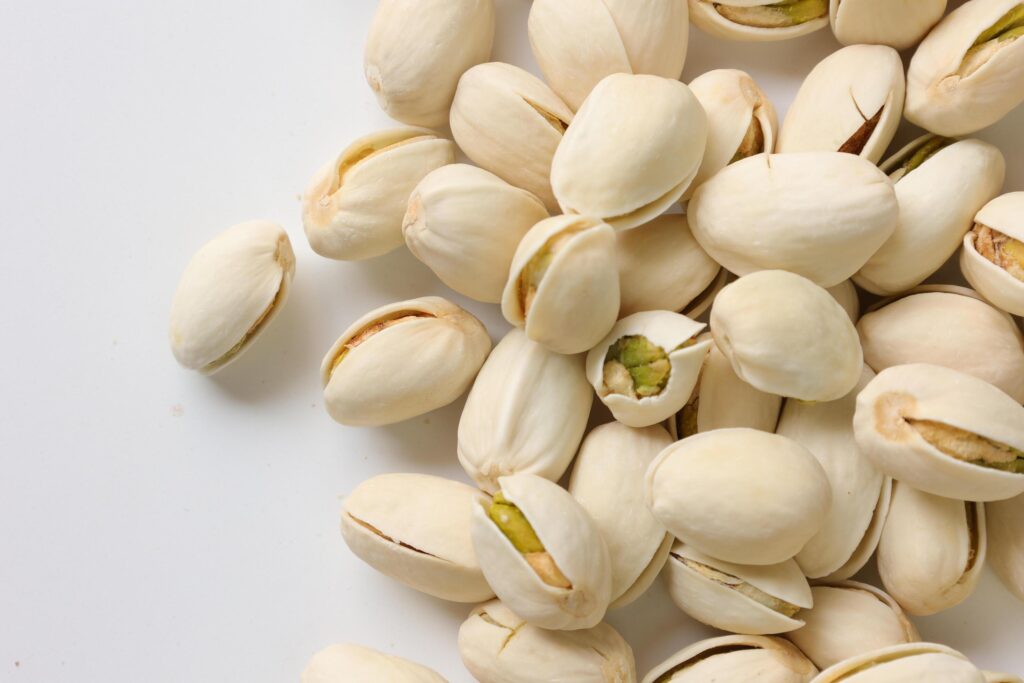 Pistachios nuts seeds on white background Stock Free