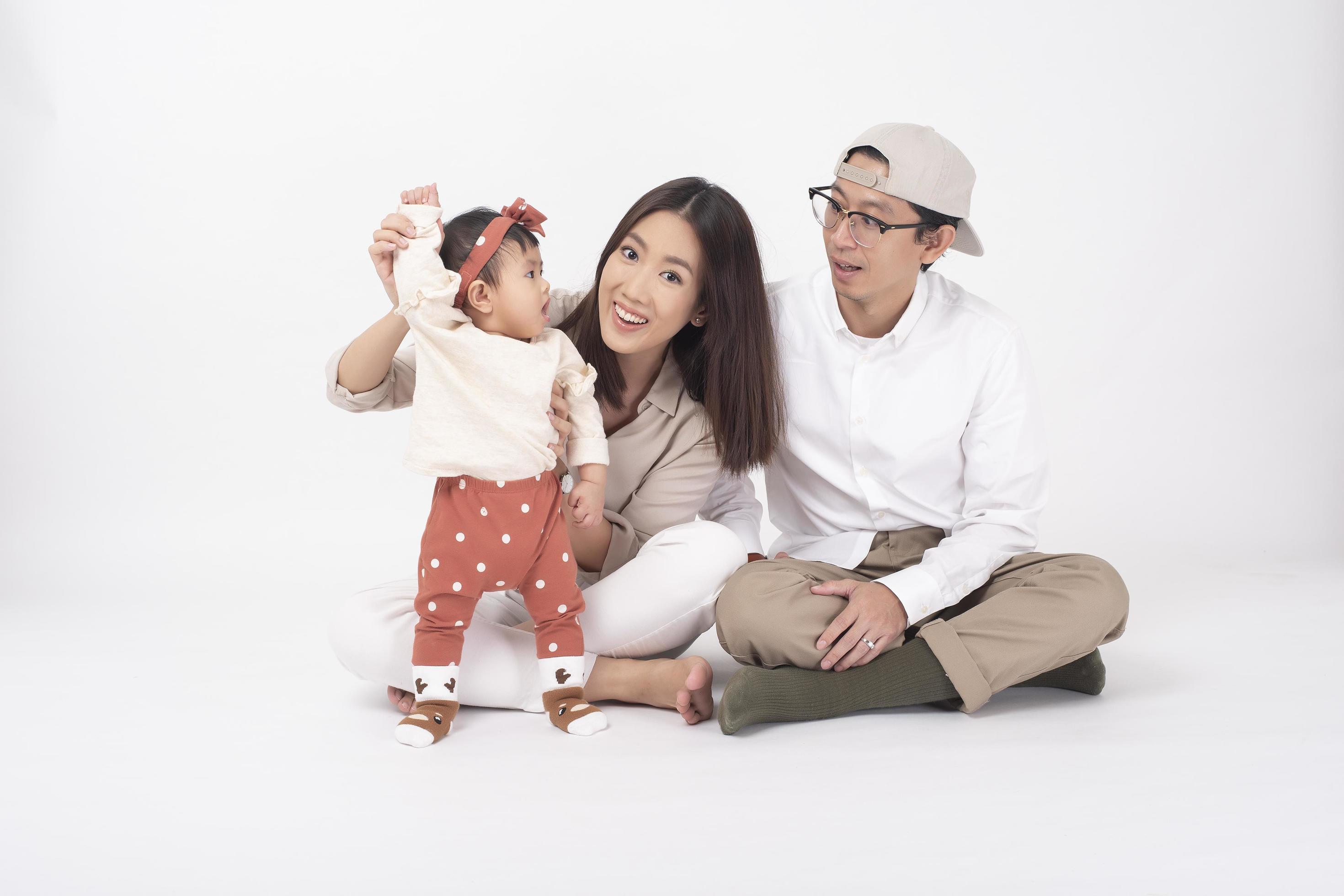 Happy Asian family on white background Stock Free