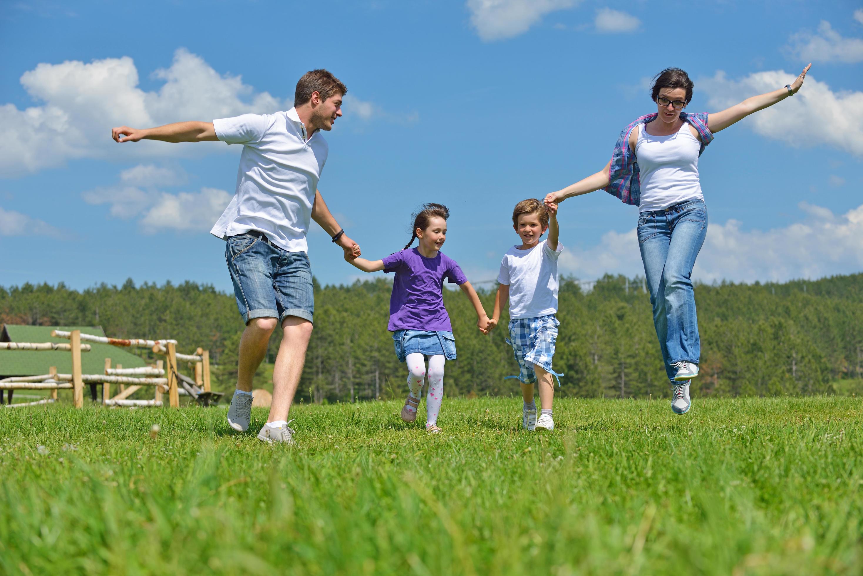 happy young family have fun outdoors Stock Free