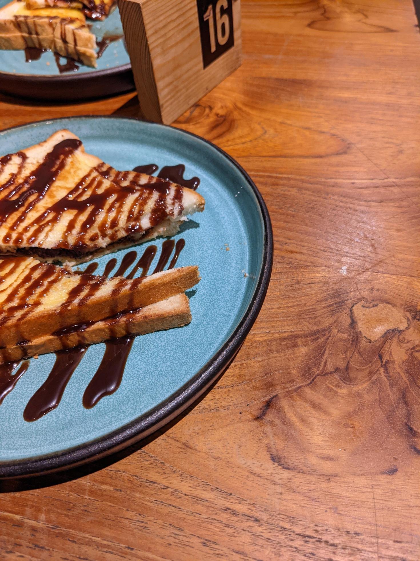 Close up photo of roasted bread with brown sugar and chocolate jam. The photo is suitable to use for food background, poster and food content media. Stock Free