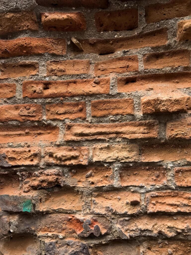 Unfinished red brick wall Stock Free