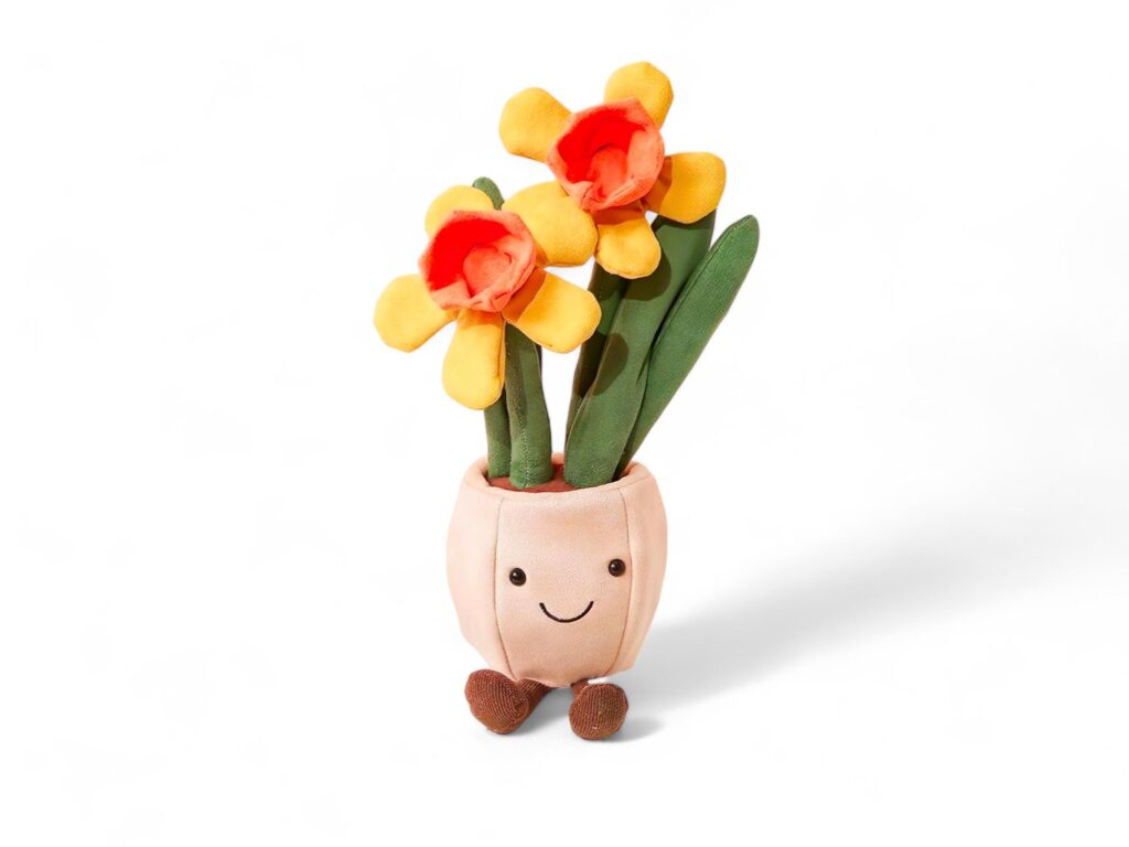 Cute stuffed flower in a pot on a white background Stock Free